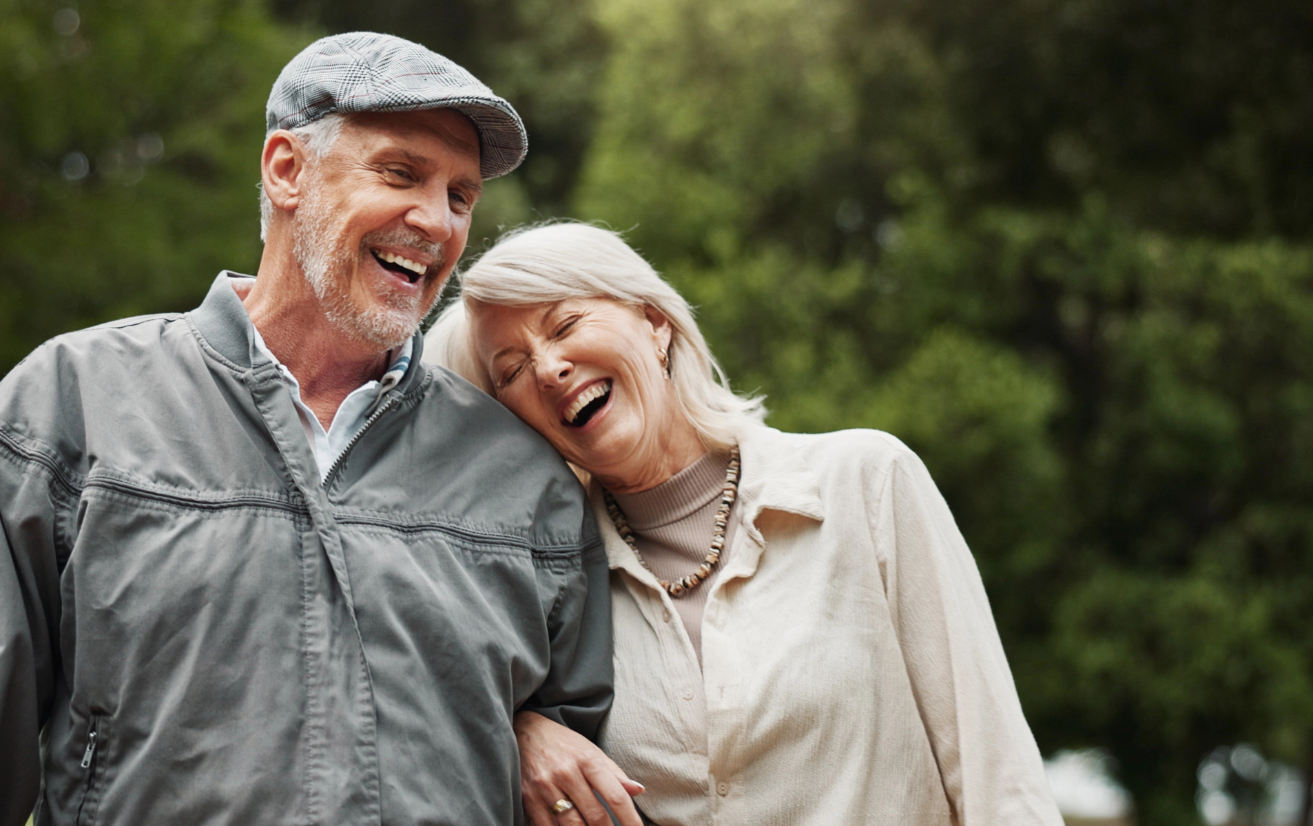 Retired couple discussing their dental care options
